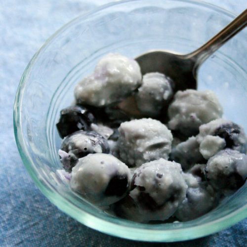 Blinky Frozen Blueberries and milk treat.